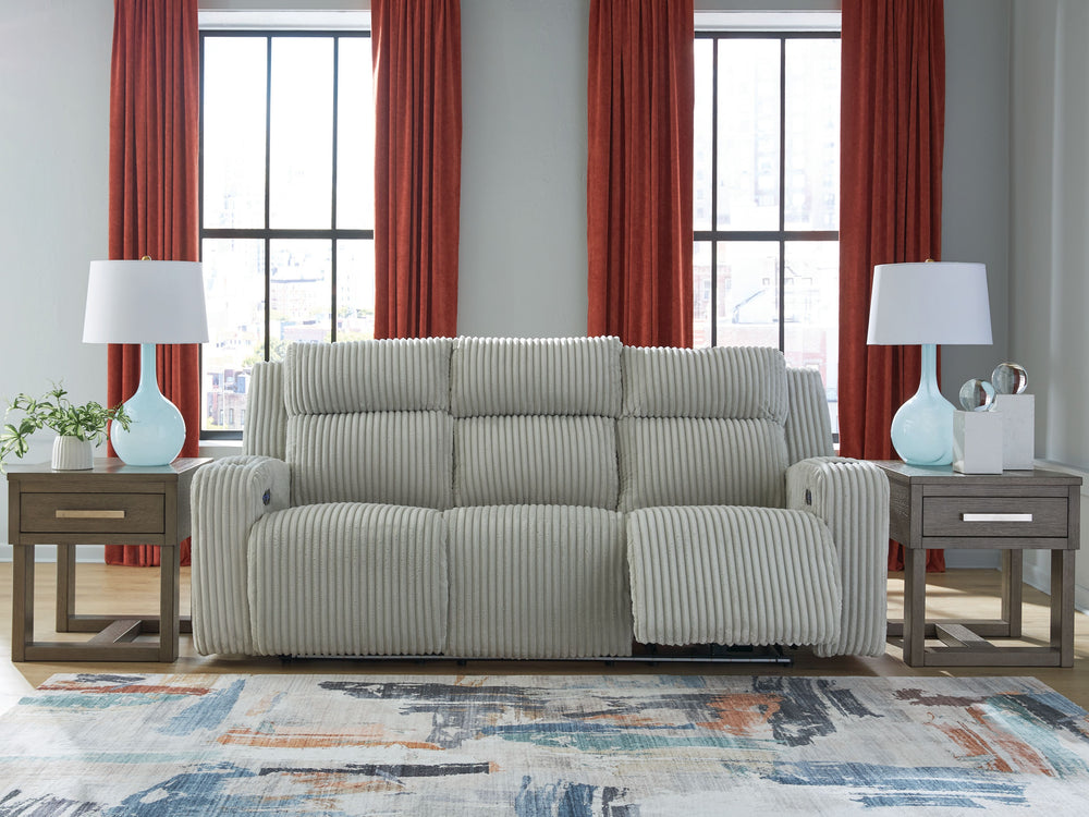 Trend-right style, meet irresistible modern function. Your living room gets a cozy-cool upgrade with this power reclining sofa. Curl up in its ultra-chic corded upholstery and recline with one-touch controls. Is it movie night or game time? With ambient L