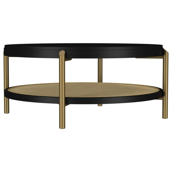 This round coffee table combines modern design with rustic charm, perfect for todayâ€™s living spaces. Crafted with Asian hardwood, engineered wood, and ash veneer, its smooth finish highlights the natural wood grain for an organic appeal. The lower shelf