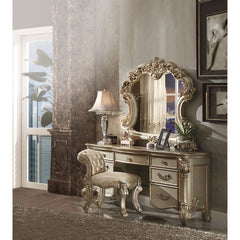 Create an elegant, traditional design in your bedroom with the Gold Patina and Bone Vendome vanity desk. This hand-crafted piece inspired from the luxurious designs of the past, this seven-drawer, desk features elaborate wood carving details, traditional 
