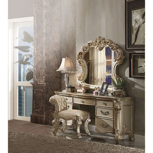 Create an elegant, traditional design in your bedroom with the Gold Patina and Bone Vendome vanity desk. This hand-crafted piece inspired from the luxurious designs of the past, this seven-drawer, desk features elaborate wood carving details, traditional 