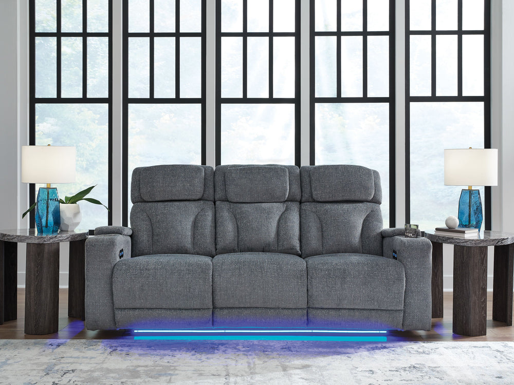 Chill-out time has never looked better. This power reclining sofa-'s adjustable headrest ensures a perfect view of the TV no matter how far back you recline, while the extended ottoman takes your comfort to the next level. A drop-down table is decked out 