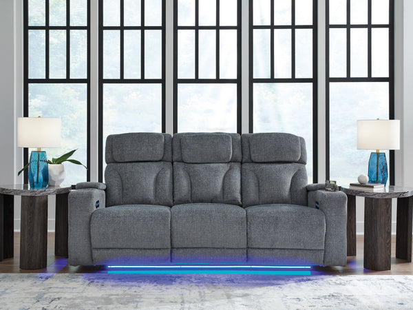  while the extended ottoman takes your comfort to the next level. A drop-down table is decked out 