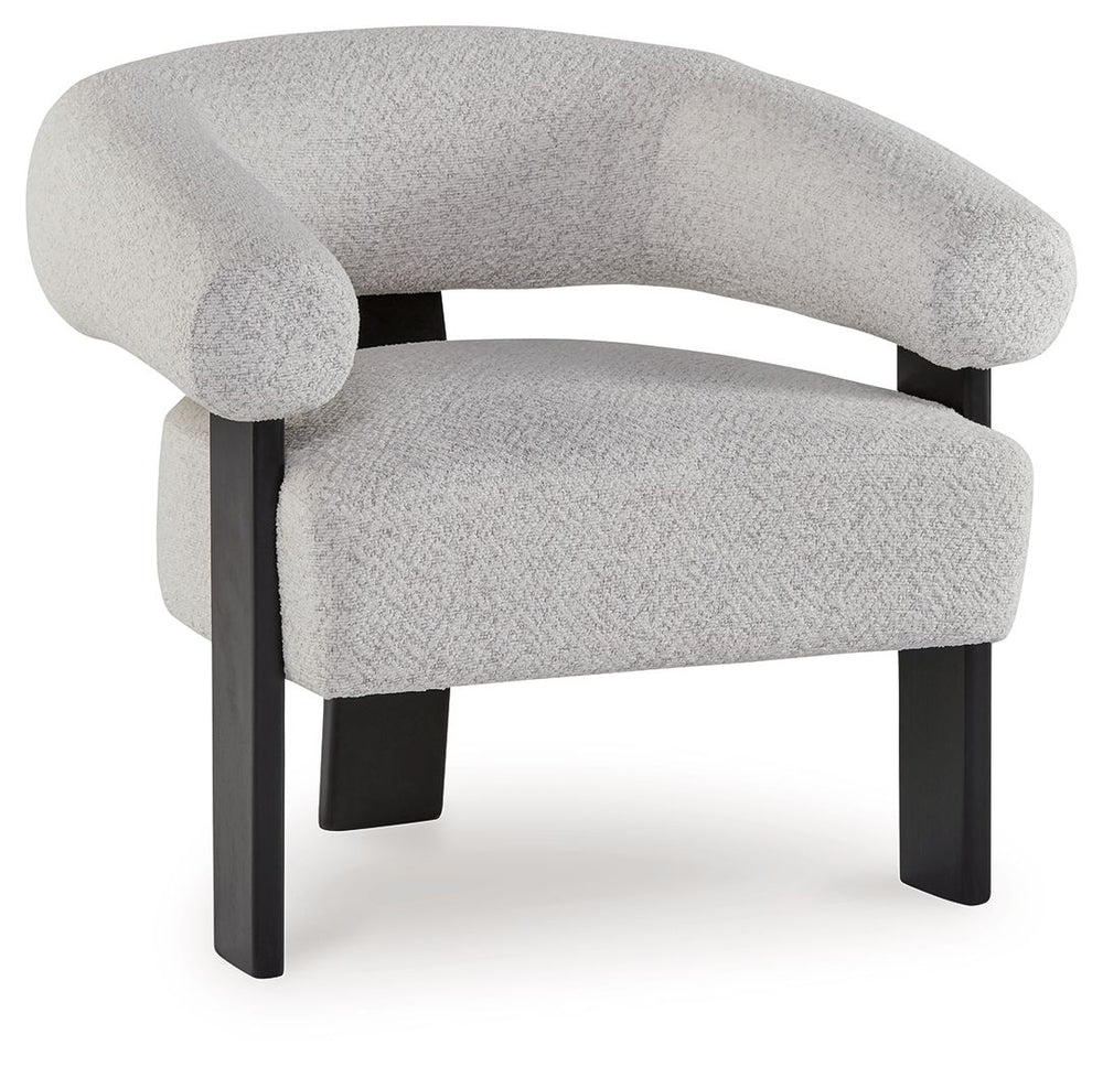 Almost sculptural in design, this accent chair is a standout addition to your seating area. Its artistic form speaks to your eye for unique contemporary design, while the ultra-soft fabric encourages an indulgent lounging experience. In contrasting black 