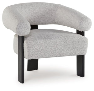 Almost sculptural in design, this accent chair is a standout addition to your seating area. Its artistic form speaks to your eye for unique contemporary design, while the ultra-soft fabric encourages an indulgent lounging experience. In contrasting black 