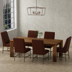 Crafted from solid mango, this table boasts a unique aesthetic with natural variations of color, wood grain, and knots. The geometric mitered edge creates a seamless transition between the table top, apron, and angled legs, and is generously proportioned 