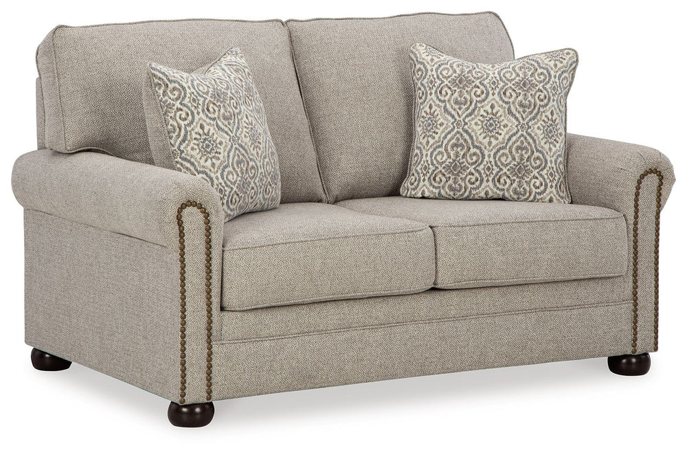 Inspired by the past but rooted firmly in the present, this loveseat complements your transitional seating area. Its versatile upholstery is delightfully detailed for a subtle herringbone effect. Designer touches like decorative nailhead trim and bun legs