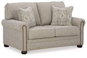 Inspired by the past but rooted firmly in the present, this loveseat complements your transitional seating area. Its versatile upholstery is delightfully detailed for a subtle herringbone effect. Designer touches like decorative nailhead trim and bun legs