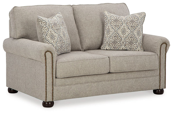 Inspired by the past but rooted firmly in the present, this loveseat complements your transitional seating area. Its versatile upholstery is delightfully detailed for a subtle herringbone effect. Designer touches like decorative nailhead trim and bun legs