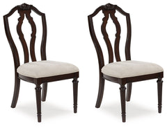 Serve up elegance and poise with this dining chair. Its traditional silhouette is detailed with a stylized back for added opulence. The cushioned seat, crisply tailored in textured tan fabric, provides added comfort. From breakfast to dinner, this chair e