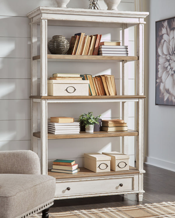  this bookcase is your heavenly home office realized. Its antiqued two-tone aesthetic blends a chipped white with a distressed wood tone top for added charm. The bookcaseâ€™s clever balance of shelf and dra
