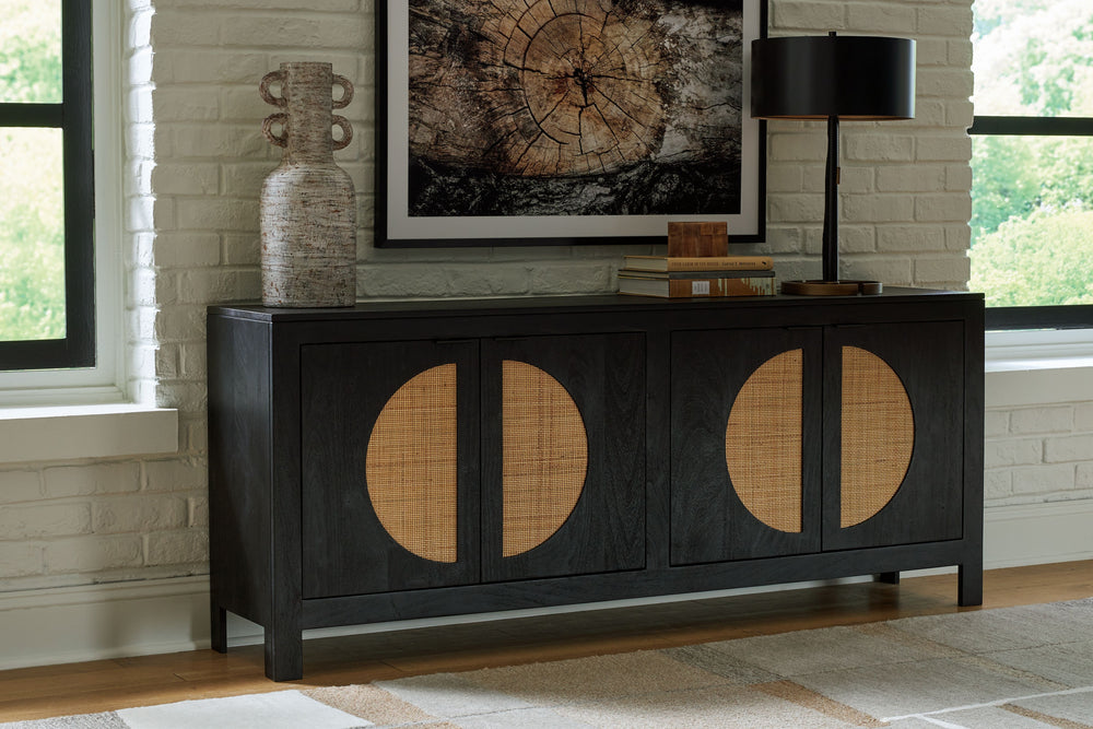 Bring high style and functionality to your home with this contemporary accent cabinet. Woven cane door fronts and a contrasting black finish bring the wow factor to this mid-century inspired piece. Whether it suits your storage needs in the dining room, h