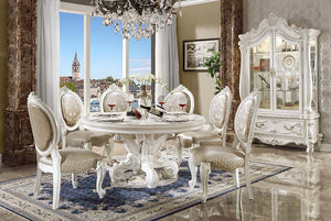 Irresistibly inviting, the Versailles collection displays the unrivaled beauty of the traditional dining. The dining table reflects highly decorative base with oversized scrolled feet, and the upholstered and tapestried chairs with deep button tufted and 