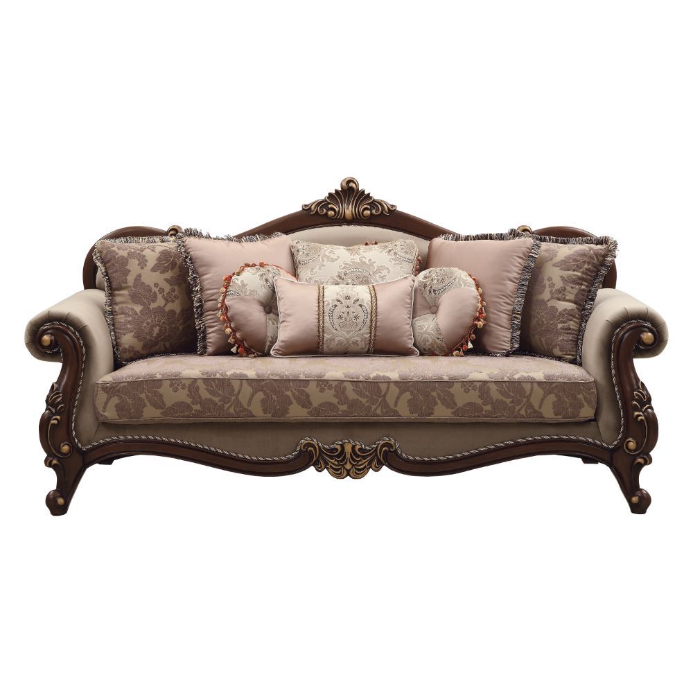 Welcome the essence of lavish living into your home with the Mehadi sofa. Shapely front posts with detailed carving, follow the elegant curve of the rolled arms that make a transition to the wood trimmed arched padded backrest which is silhouetted by a ca