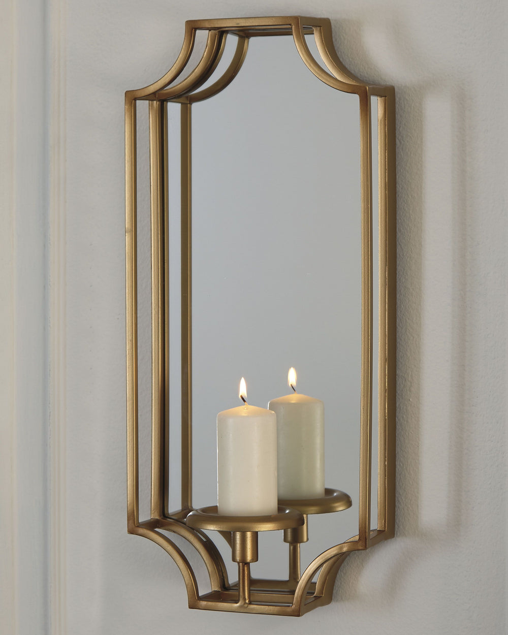 Take a shine to a more glamorous way of life with this exquisite wall sconce. Watch its mirrored surface and luminous goldtone metal truly come to life through the beauty of candlelight.<br><br><b>Additional Dimensions</b><br><ul><li>Inner mirror: 0-"</li