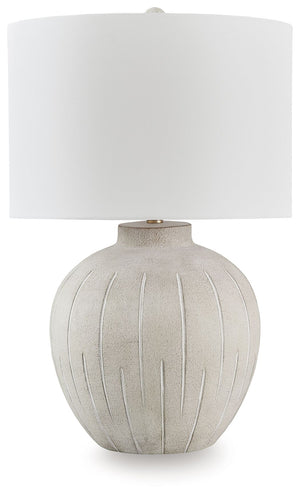 This is one casually cool table lamp. Its textured, neutral-toned base exudes a relaxed, inviting vibe that fits seamlessly into a variety of decors. Ideal for adding that cozy touch, this lamp lightens the mood and brightens your living space, bedroom or