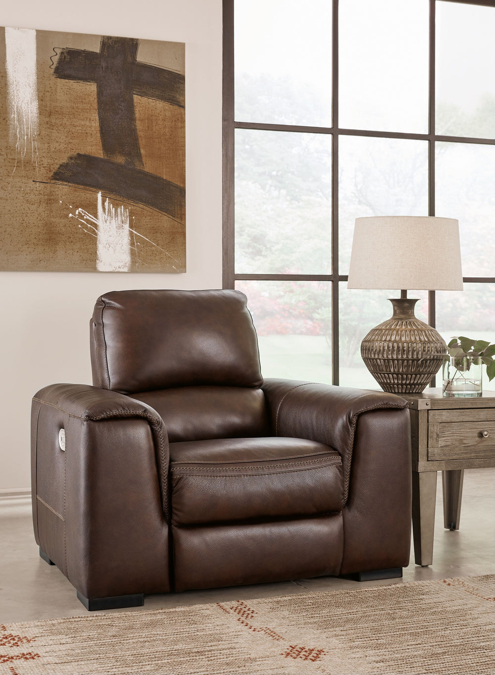 Impressive in scale while keeping an air of refinement, this power recliner stuns with a combination of soft, supple leather and perfectly matched faux leather upholstery in walnut. Sink into the seating area and cater to your comfort with one-touch power