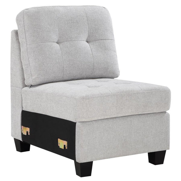 Build the sectional that suits your space with a modern armless chair. In soft beige upholstery, it-'s the perfect way to extend your Georgina collection sectional sofa, adding length to suit your living room. The chair features tufted cushions and sinuou