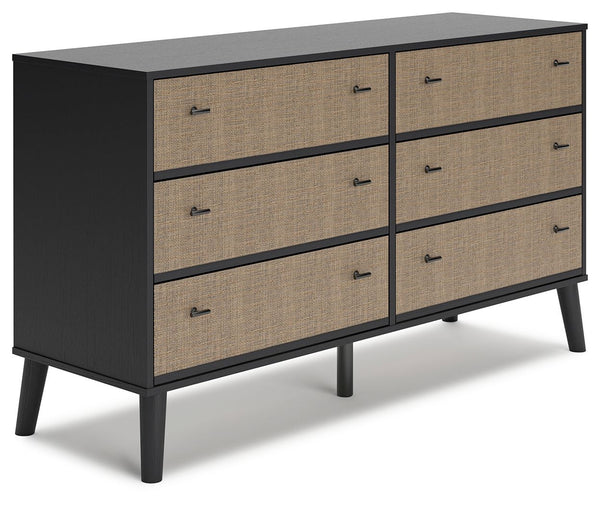 Put a retro spin on current trends with this dresser. Its mixed-material look of matte black and replicated beige cane brings a casually cool feel to your bedroom. Simple, sleek hardware and splay legs round out the urban meets mid-century vibe.<br><br><b
