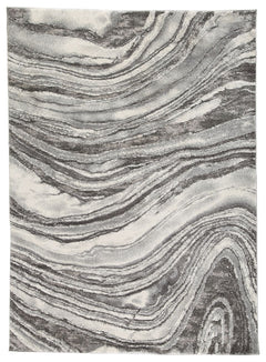 Inspired by gorgeous quartz bands of agate, this area rug displays flowing ribbons of color. Its machine-woven high-low agate design, in ivory and shades of gray, features deep, rich hues while maintaining exceptional durability. Comfortable and sophistic