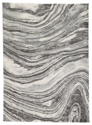Inspired by gorgeous quartz bands of agate, this area rug displays flowing ribbons of color. Its machine-woven high-low agate design, in ivory and shades of gray, features deep, rich hues while maintaining exceptional durability. Comfortable and sophistic