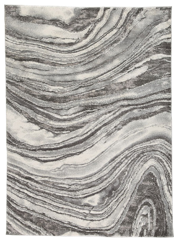 Inspired by gorgeous quartz bands of agate, this area rug displays flowing ribbons of color. Its machine-woven high-low agate design, in ivory and shades of gray, features deep, rich hues while maintaining exceptional durability. Comfortable and sophistic