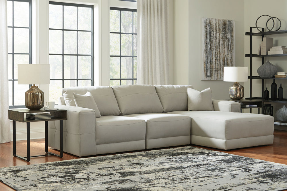 The expansive silhouette of this sectional invites you to spread out and relax. Upholstered in a durable gray faux leather that captures the look and feel of nubuck leather, this stunning piece envelops you in baby-soft comfort. Its clean modern aesthetic