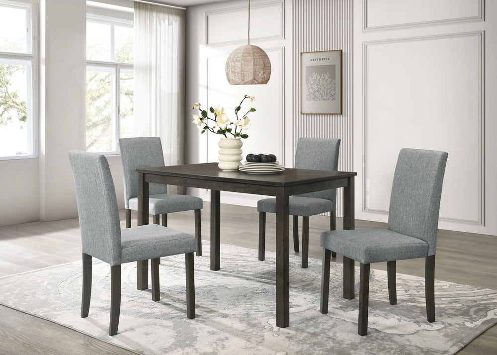 This dining group is a perfect fusion of minimalist design and everyday practicality. The sleek, rectangular table boasts a smooth, dark wood finish that adds a touch of sophistication to any dining space. Complemented by four comfortable upholstered chai