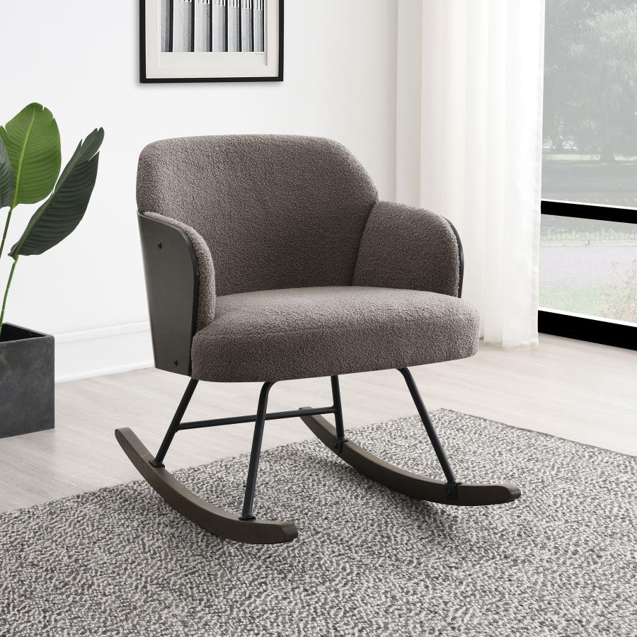 This modern rocking chair blends cozy comfort with sophisticated design, making it an ideal addition to any contemporary home. The plush boucle fabric upholstery wraps the seat and backrest, providing a soft and inviting surface. The walnut-finished bentw