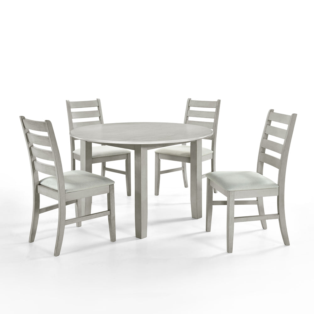 Experience the Pascal 5 Piece Dining Room Set in Driftwood Gray, featuring a round wood table and four dining chairs. Crafted from a blend of solid Rubberwood and manufactured woods, this set ensures long-lasting durability. The solid wood chairs are rein