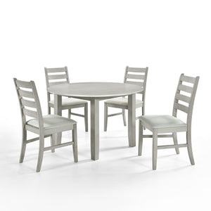 Experience the Pascal 5 Piece Dining Room Set in Driftwood Gray, featuring a round wood table and four dining chairs. Crafted from a blend of solid Rubberwood and manufactured woods, this set ensures long-lasting durability. The solid wood chairs are rein