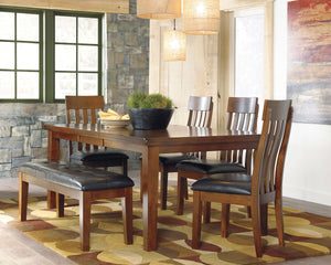 Made with select acacia veneers and hardwood solids. Gently distressed and burnished dark brown finish. D594-35 has a planked table design with thick-look tops and butterfly leaf. Seat covers in brown faux leather. Server features a working drawer along w