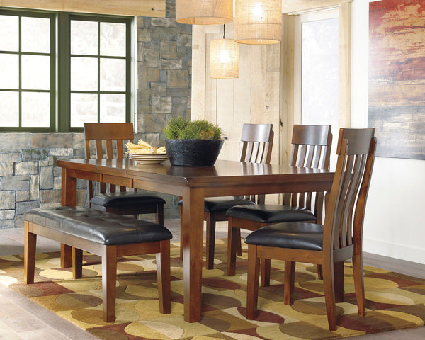 Made with select acacia veneers and hardwood solids. Gently distressed and burnished dark brown finish. D594-35 has a planked table design with thick-look tops and butterfly leaf. Seat covers in brown faux leather. Server features a working drawer along w