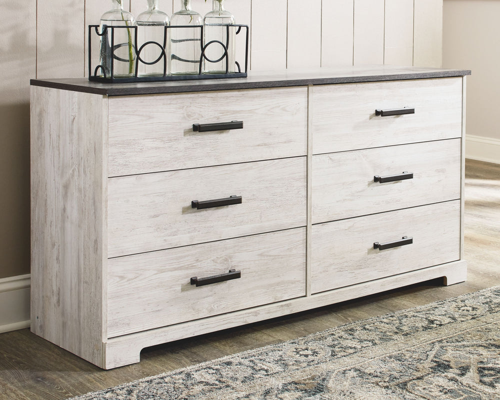 Give provincial a new meaning with the chic look of this dresser. The two-tone finish keeps this piece light and fresh while the warm pewter-tone hardware adds an industrial touch. The distressed whitewashed body adds a delightfully homespun charm to your