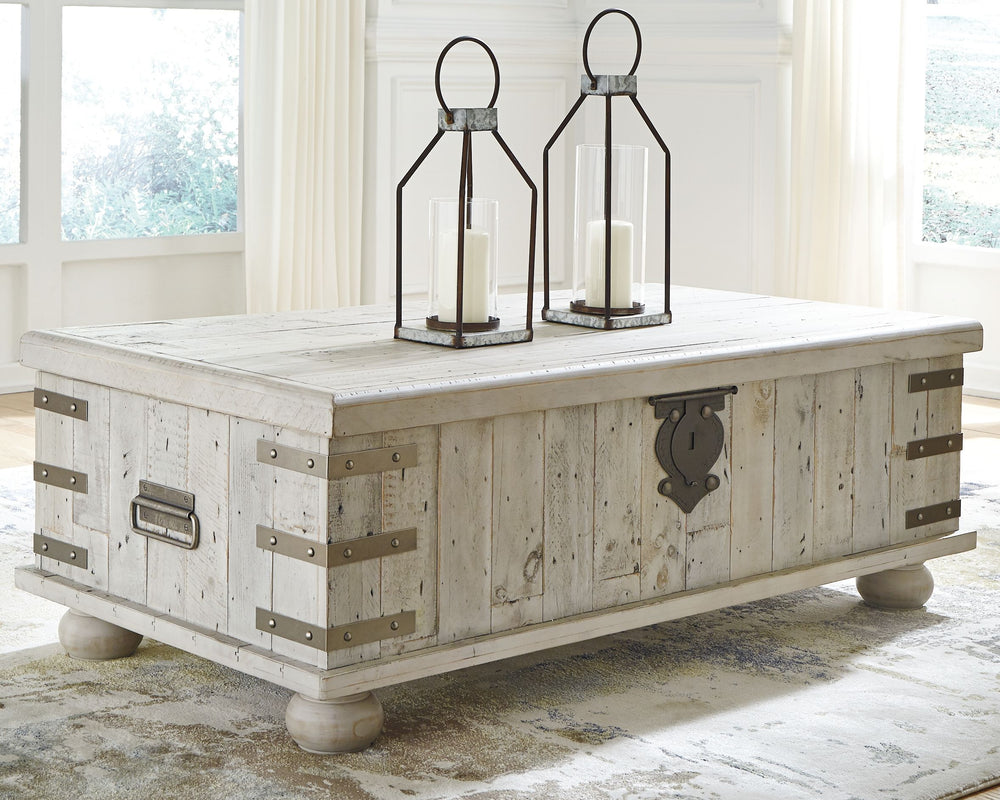 Unlock a quaint touch of farmhouse style and convenience in your living area with this lift top coffee table. Its design is inspired by the rugged looks of an antique storage trunk. Metal keyhole and bracket accents with rivets, a planked effect and large
