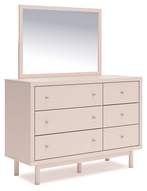 Pretty in pink. This dresser with mirror keeps the spirit of your homeâ€™s modern aesthetic while suiting all your young oneâ€™s needs. Its subtle blush finish brings a playful, charming vibe to organizing clothes and other essentials. Made for her and st