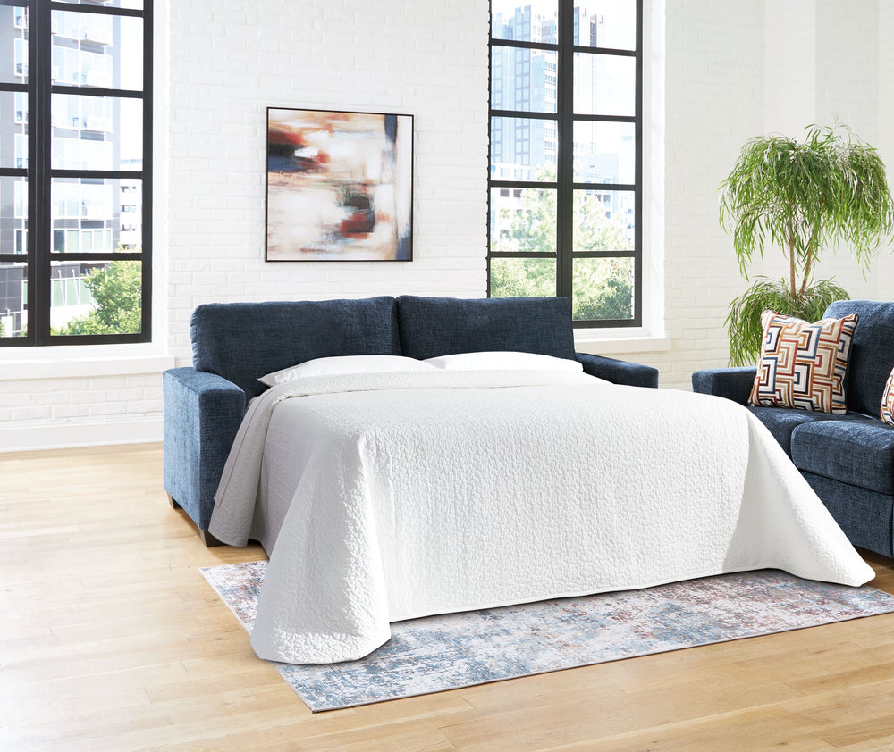 Looking to make a bold statement with color? Liven up your living room with this queen sofa sleeper. Its trend-right navy blue upholstery adds a playful pop of color to your decor. Bold and eclectic accent pillows complete the look. Pairing posh style wit