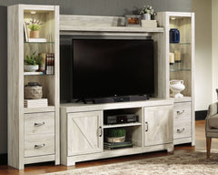 Express your farmhouse style with this entertainment center. Its wispy white finish over replicated oak wood grain is a delightful change from the ordinary. Clean-lined, classic styling with barn door inspiration provides a country chic aesthetic thatâ€™s