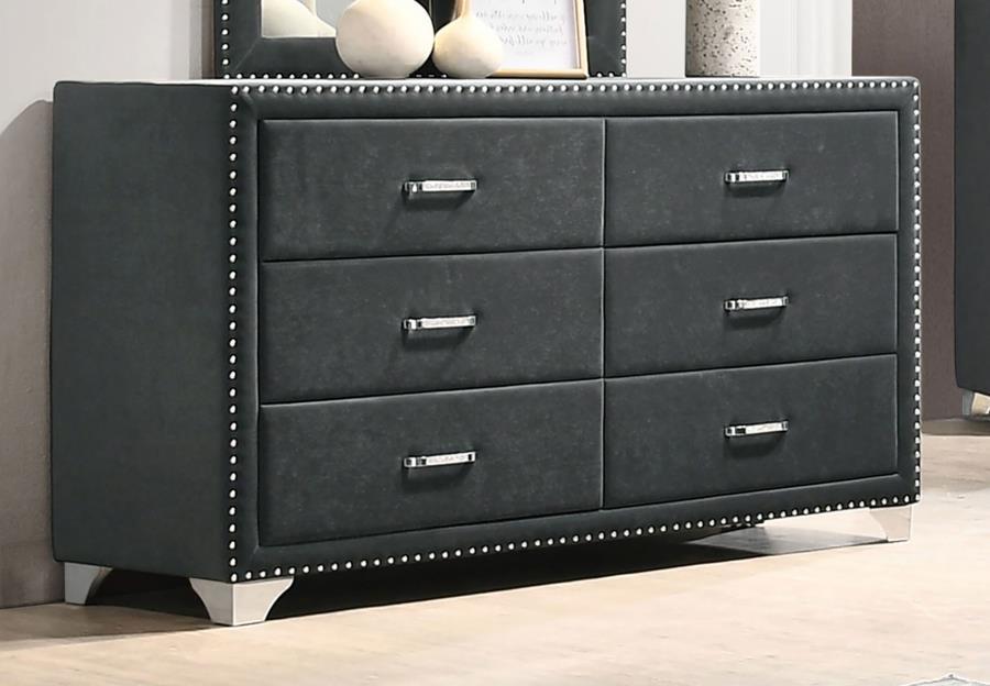 Give outdated sleeping spaces a facelift with this eye-popping and elegant dresser. Entirely upholstered in velvet, this dresser is a conversation starter. It is equipped with six spacious drawers to store your bedside items. Nail head trim makes a specta