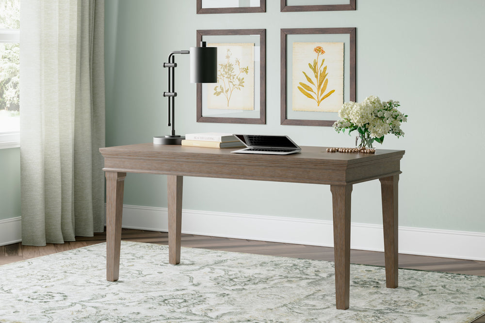 Make a style statement with this home office desk. Its traditional design is updated with an on-trend weathered gray finish and wire-brushed texture. The desk-'s large tabletop makes for a well-organized workspace.<br><br><b>Additional Dimensions</b><br><