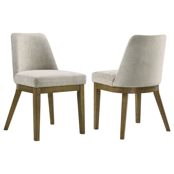 Complete your dining ensemble with this set of two modern side chairs. Offering inviting ambiance to your kitchen or dining room, the pair features a neutral look with a brown oak wood grain finish. Light tan fabric upholstery adds a touch of contrast and