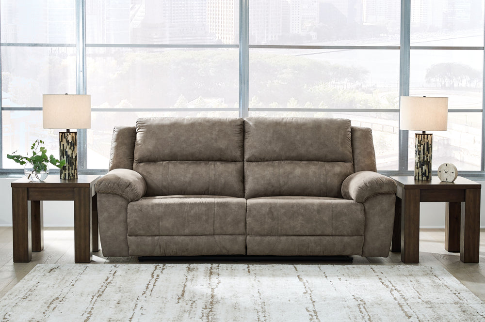 Is being too comfortable even possible? Itâ€™s worth finding out in this reclining sofa. Wrapped in the plushest of neutral faux leather upholstery, it-'s perfectly cushioned in all the right places. We love the sofa-'s super-wide seating, with plenty of 