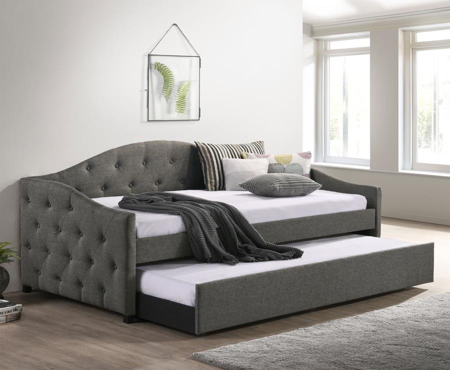Sweeping lines and timeless details come together in this transitional twin daybed and trundle set. Wrapped in a soft fabric that coordinates with all sorts of color palettes, this daybed and trundle combo lends traditional elements such as a button-tufte