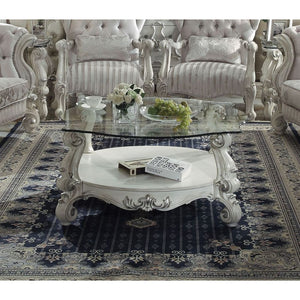 KD, Coffee Table w/Curved Glass Top â€¢ Open Compartment: Bottom Shelf â€¢ 10mm Clear Tempered Glass w/Beveled â€¢ Oversized Scrolled Legs & Shelf Apron: Poly Resin with Antique Contrast Finish<br/><br/><b>Product Features</b><ul><li>Coffee Table w/Curved