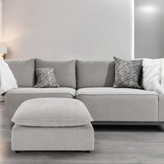 Marisa sectional sofa in luxurious beige boucle fabric is a perfect blend of style and comfort. With its plush pillows and spacious seating, it invites you to unwind in elegance. Ideal for any modern living room, this sectional offers a chic and cozy atmo