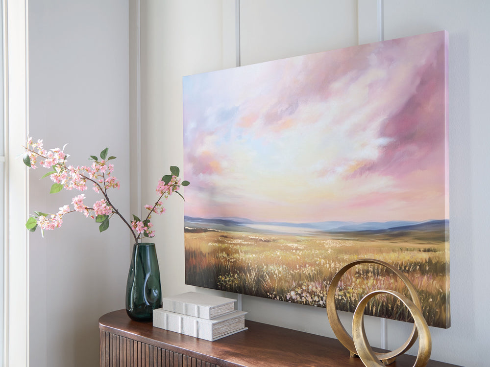 Staggerlingly beautiful. Depicting a luminous landscape, this wall art captures a spectacular sky in soothing shades of pink, blue and yellow as sunlight beams on a field of florals. Hand painted embellishments make the canvas a gorgeous addition to an of