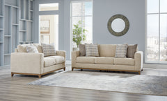 Serene style with a modern sensibility. Delight in the cozy, versatile embrace of this living room set. It takes an on-trend approach to irresistible texture and natural beauty, showcasing soft neutral upholstery accented with a transitional wood trim. As