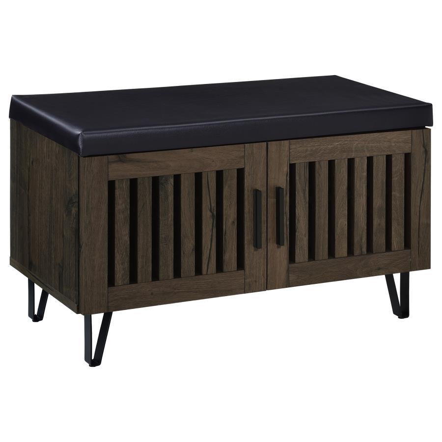 This modern storage bench combines style and functionality, featuring a faux leather upholstered padded top for added versatility as a seating bench. The cabinetâ€™s two doors showcase a vertical slat design, enhancing its contemporary aesthetic while all