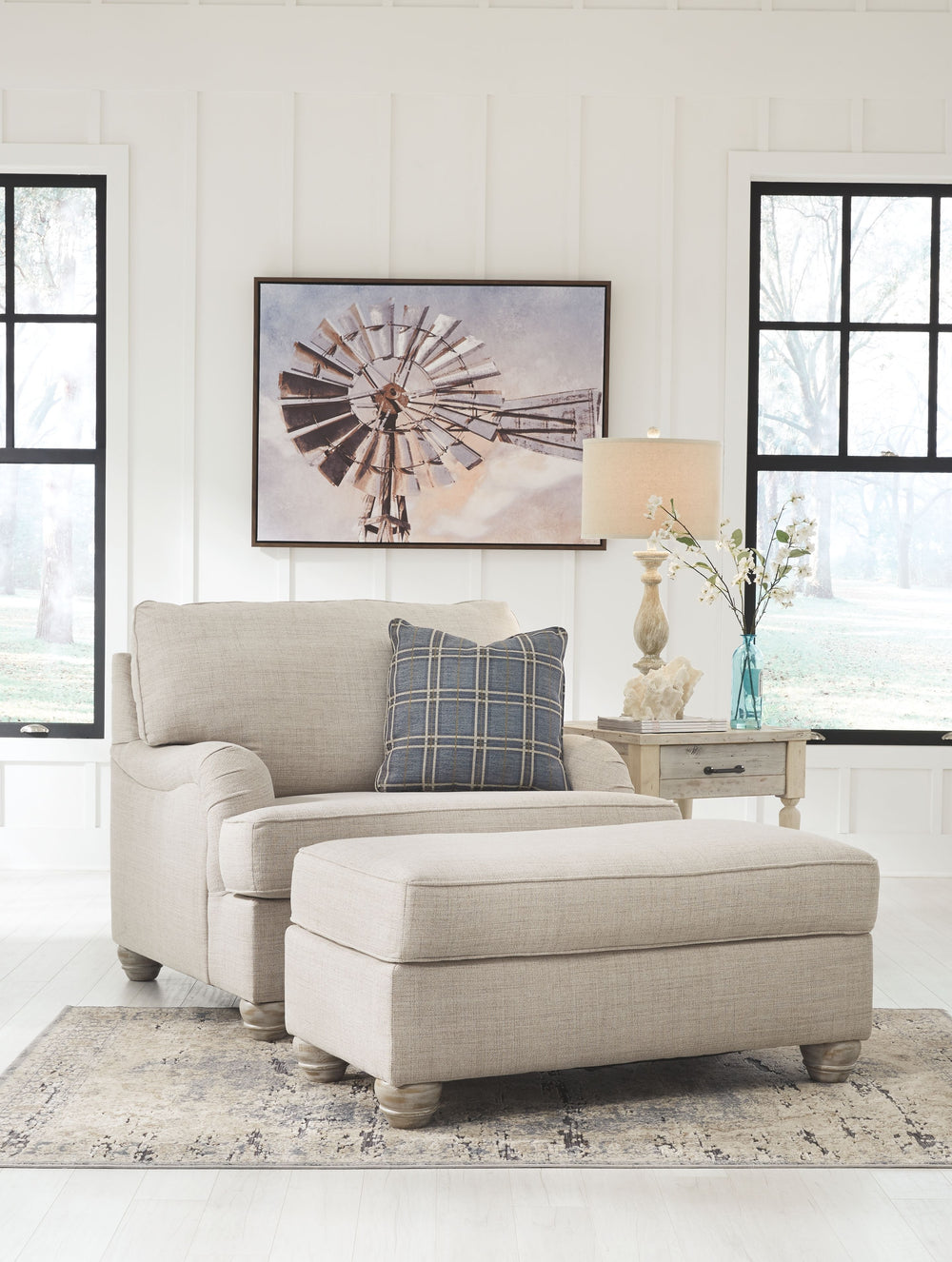 For a fresh spot in your space, turn to this designer chair and ottoman. Wind down at the end of a long day when you sink into this canyon of comfort. <h4><b>Traemore - Linen - Chair and a Half</b></h4> <table width=-"100%-"><colgroup><col style=-"width: 