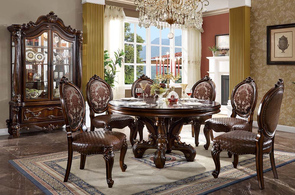 Irresistibly inviting, the Versailles collection displays the unrivaled beauty of the traditional dining. The dining table reflects highly decorative base with oversized scrolled feet, and the upholstered and tapestried chairs with deep button tufted and 
