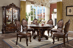 Irresistibly inviting, the Versailles collection displays the unrivaled beauty of the traditional dining. The dining table reflects highly decorative base with oversized scrolled feet, and the upholstered and tapestried chairs with deep button tufted and 